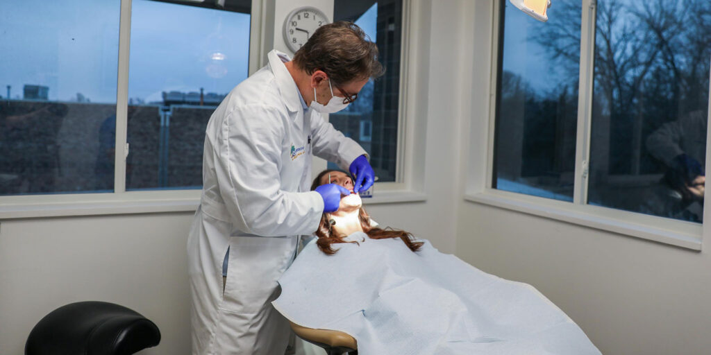 Doctor Roderick Vansurksum Working on a Oral and Maxillofacial Patient